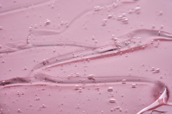 The texture of the cosmetic gel on a pink background. - Stock Photo - Images