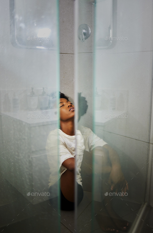 Mental health, anxiety and depression by sad woman sitting on floor the