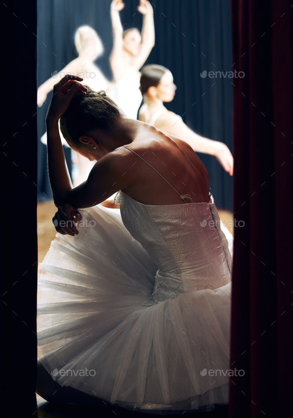 Dancer worry backstage at ballet concert or recital while group on theater stage. Girl ballerina st