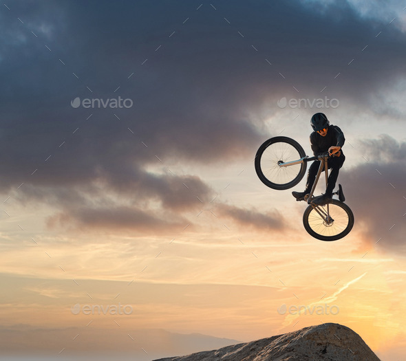 Mountain bike, jump and sport with mockup of a man athlete with energy and speed in nature. Healthy