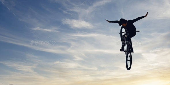 Mountain bike man, sky jump and energy of action, freedom and competition silhouette, shadow and mo
