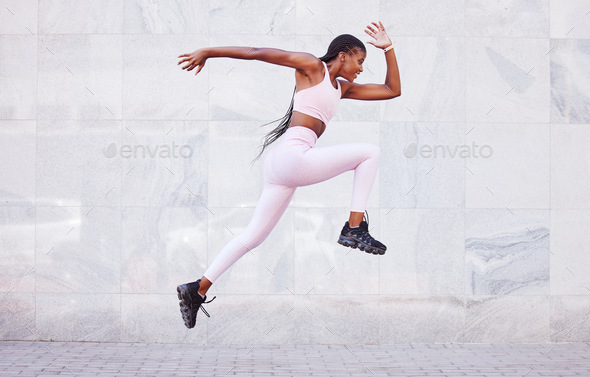 Energy, sports and black woman jump running outdoor for fitness, wellness and outdoor training with