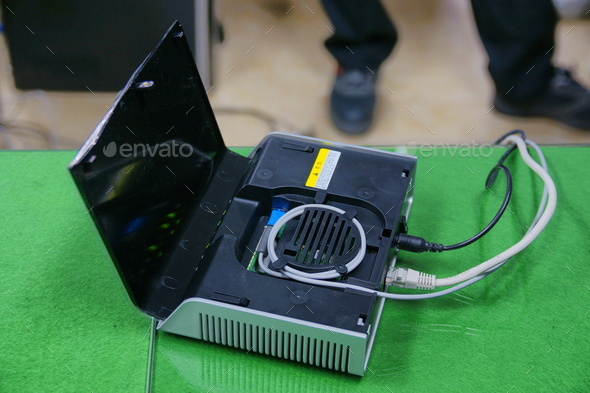 Installing cable into the Optical Network Unit Stock Photo by eelinstudio