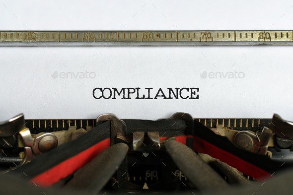 The word Compliance typed with a vintage typewriter  - Stock Photo - Images