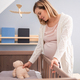 Pregnant woman preparing child room for expected newborn baby - PhotoDune Item for Sale