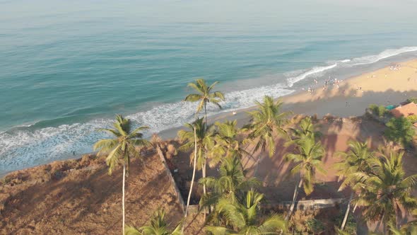 Aerial footage of a bird attacking a drone while flying way from Varkala Beach, India. alt