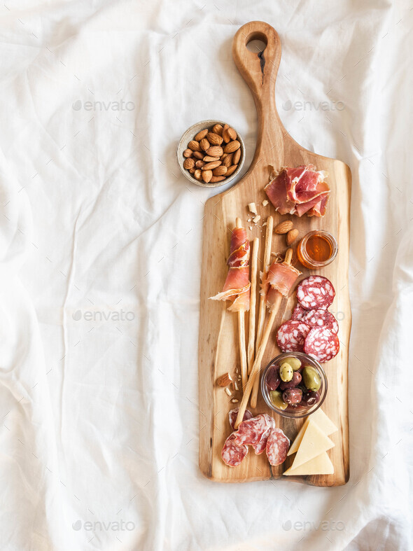 Snack set table. Variety of sausage, olives, cheese, bread sticks Stock