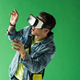 surprised mixed race man in vr headset gesturing while experiencing virtual reality on green screen - PhotoDune Item for Sale