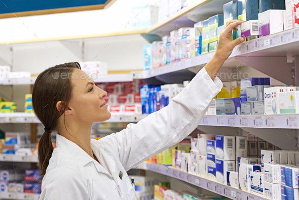 She knows her customers needs. Shot of an attractive young pharmacist checking stock in an aisle.