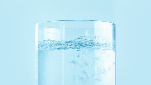 Jug Of Clear Water Poured Into Glass Closeup alt