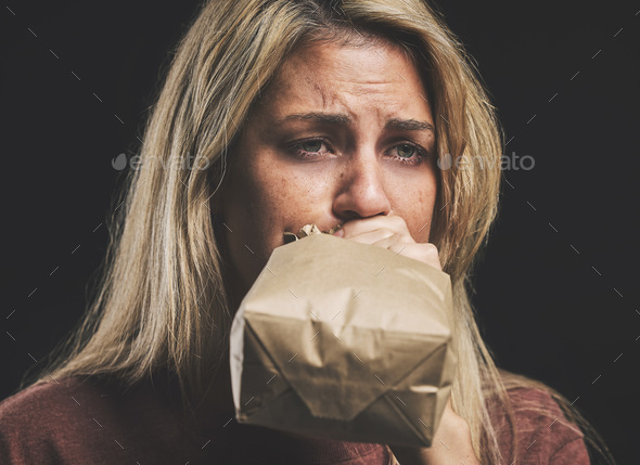 Anxiety, nausea and woman with paper bag for stress and panic attack relief with black mockup. Girl