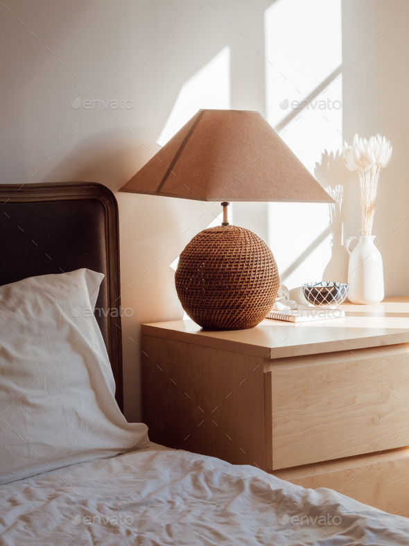Modern home interior with bedroom setting including bedside table Stock Photo by filiaolga