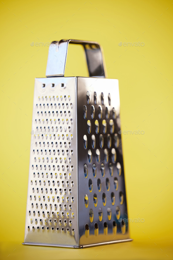 Grater in stainless steel isolated on white background /// cheese