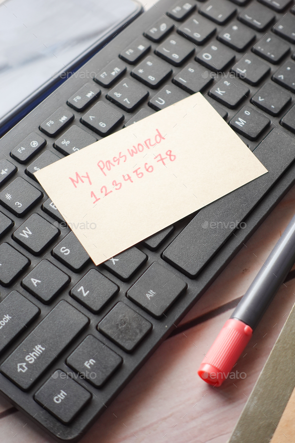 writing password on a sticky note  - Stock Photo - Images
