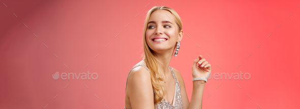 Elegant glamour gorgeous young rich blond woman attend charity party in stylish silver glittering