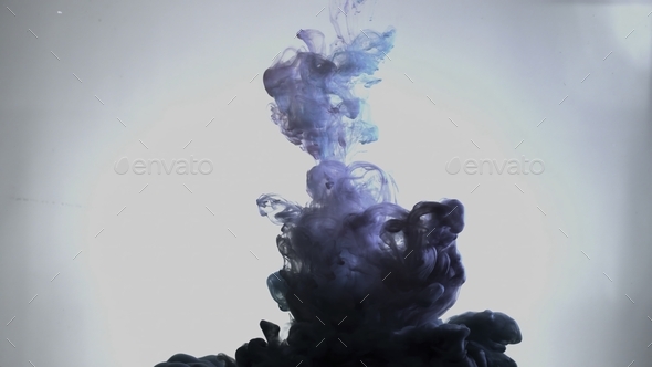 Smoky blue and pink ink in motion on water. Abstract pattern with blue colours ink in water. Blue