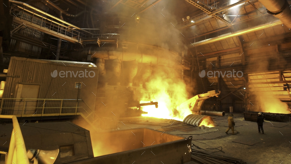 Copper production at the metallurgical plant, dangerous work concept. Stock footage. Molten metal in