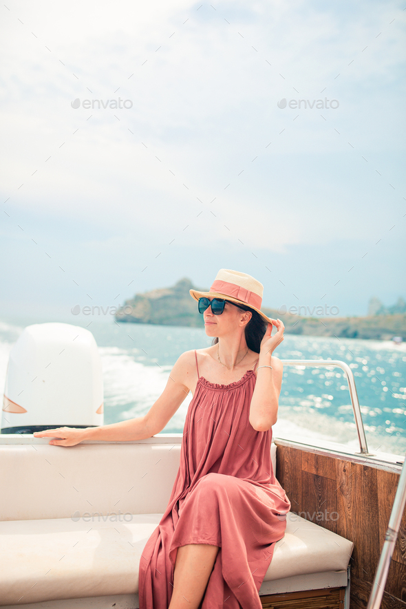Luxury trip on the boat. Beautiful woman enjoying luxury yacht cruise