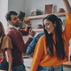 Beautiful young people dancing and smiling while enjoying party at home together - PhotoDune Item for Sale