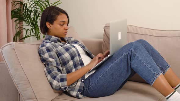 Tired African American Woman Working at Home Online