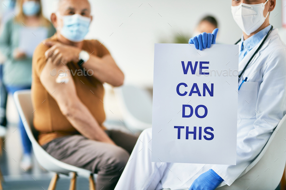 Doctor showing placard with 