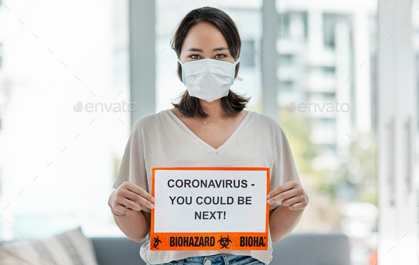No one is exempt. Shot of a woman holding up a sign saying CORONAVIRUS - YOU COULD BE NEXT. - Stock Photo - Images