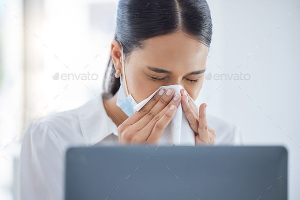 Covid, sick and blowing nose with a business woman sneezing into a tissue while suffering with a co