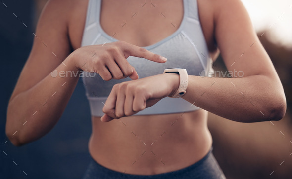 Fitness, time and woman runner with a smartwatch tracking running performance, heart rate and monit