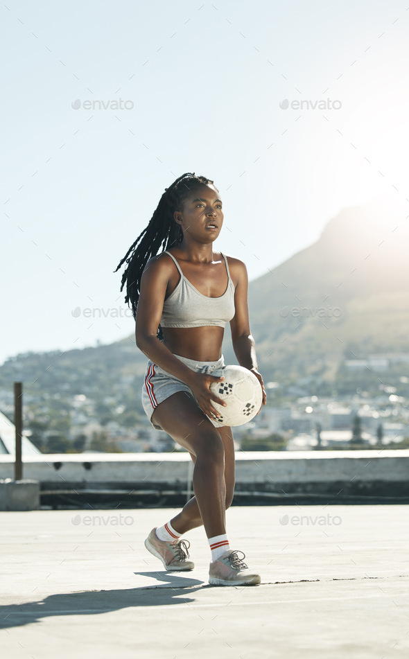 City, girl and soccer on rooftop for sports fitness training with concentration in South Africa. Ex