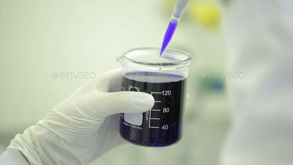Test tubes closeup. Medical equipment. Close-up footage of a scientist using a micro pipette in a