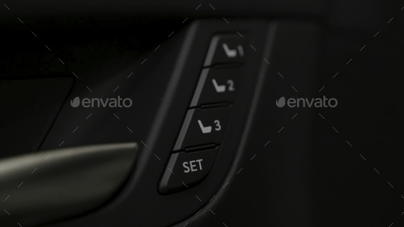 Close up for the side door buttons of a modern luxury car interior. Action. Car salon details, small - Stock Photo - Images
