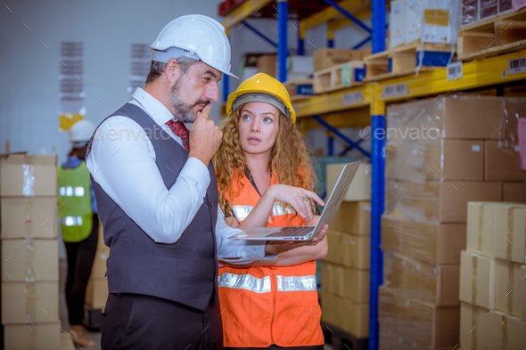 Industry manager and worker under discussion about production at ...