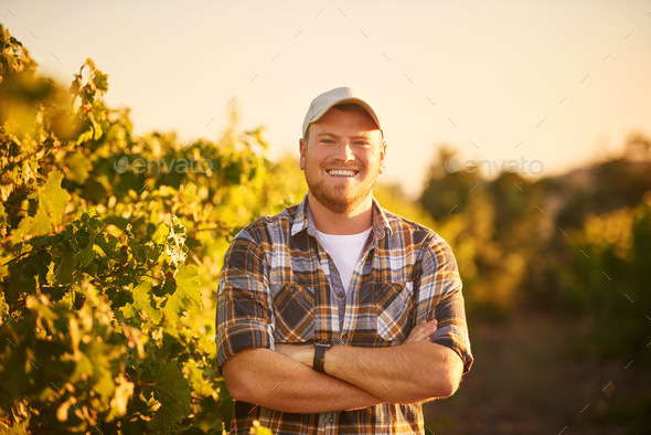 Farming is in my blood. Portrait of a happy farmer posing with his arms ...