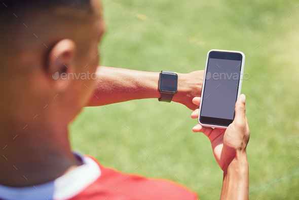 Green screen, soccer player and phone on field with smartwatch, tech or mockup on mobile digital ap