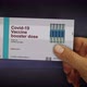 Covid-19 Vaccine booster dose pack in hand - VideoHive Item for Sale
