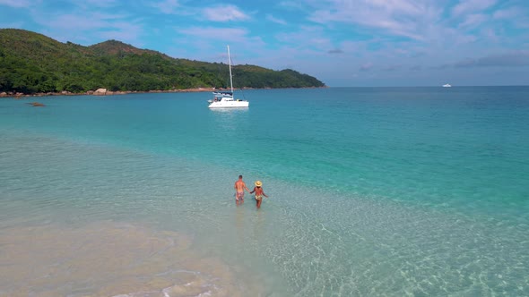 Praslin Seychelles Tropical Island with Withe Beaches and Palm Trees Couple Men and Women Mid Age on alt