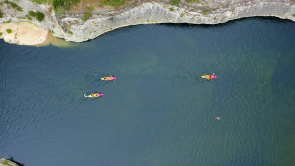 Aerial drone view following kayaks.  alt