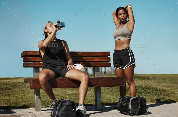 Man, woman and fitness break for stretching, drinking water or muscle recovery after training, exer