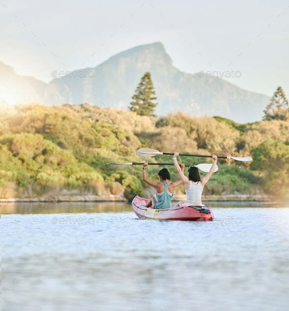 Woman friends, rowing kayak and lake exercise in canoe together