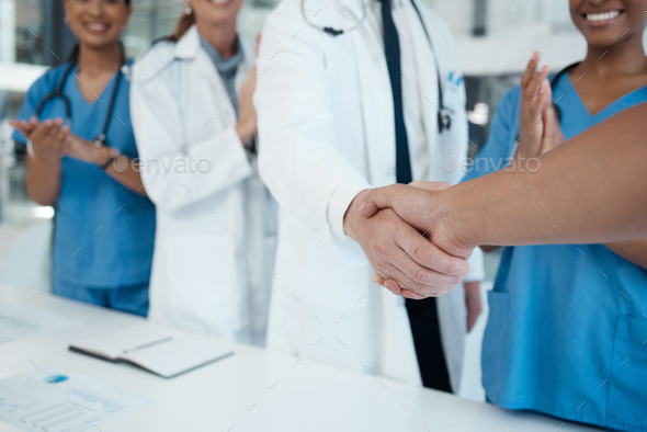 Doctors, nurses and handshake success in medical partnership, insurance deal or healthcare support