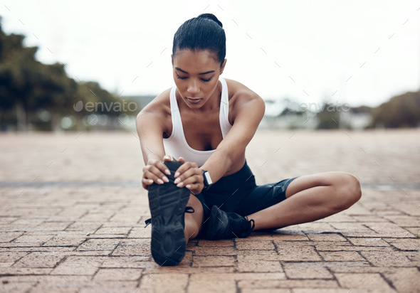 Fitness, sports and woman stretching legs in warm up to start training, exercise and cardio workout
