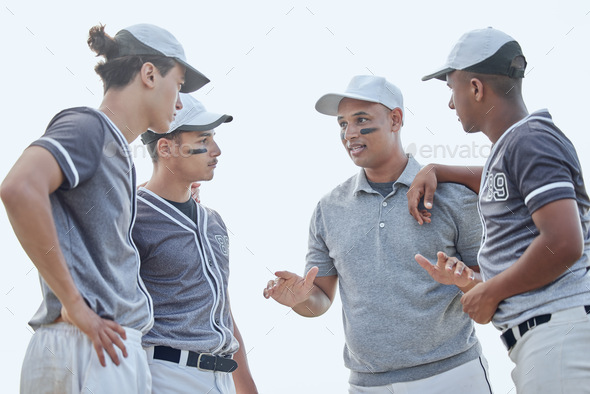 Baseball coach from below giving match pep talk and planning game strategy with group of players in