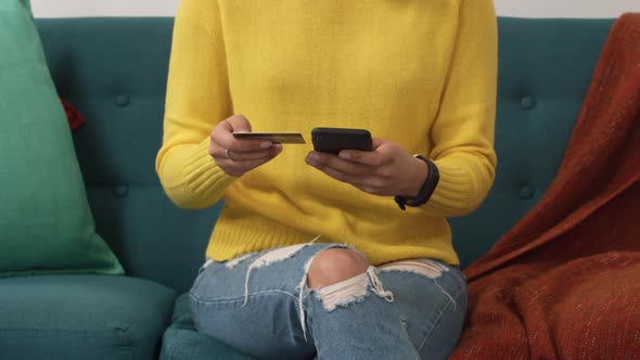 Woman wearing hijab stretching outside alt
