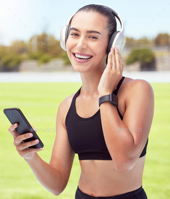 Headphones, fitness and smartphone with woman listening to motivation podcast or music outdoor on s