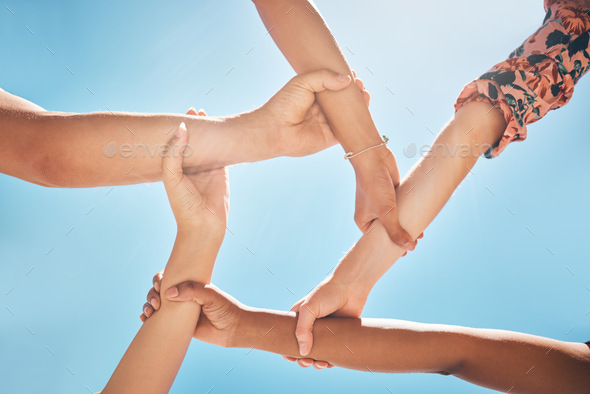 Team of people support, hands connect or link together global community of cooperation on blue sky.