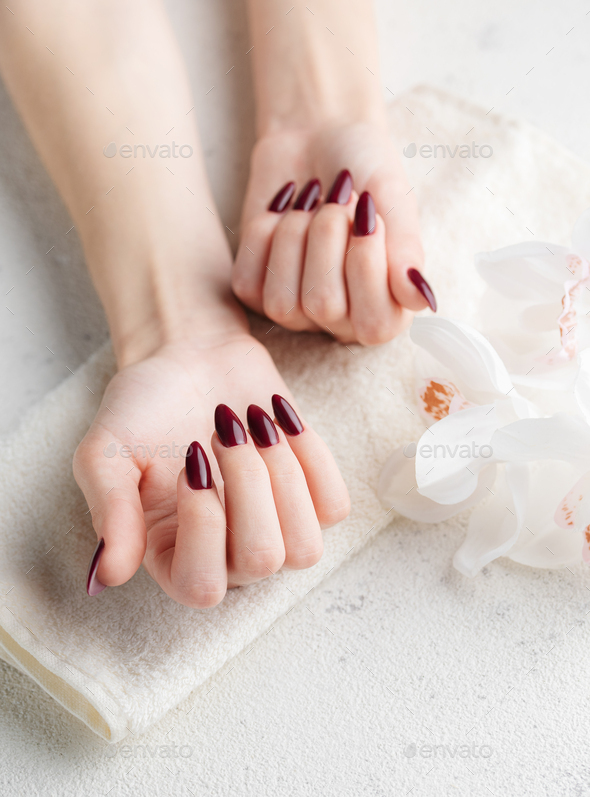 Close up of woman's hands with red nail polish Stock Photo - Alamy