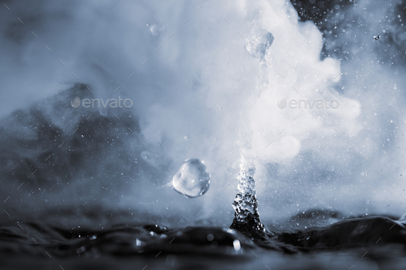Boiling water splash with steam on black background closeup Stock Photo ...