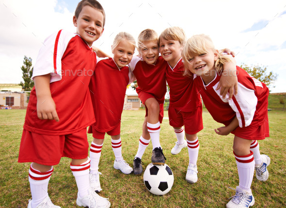 Kids just wanna have fun. Shot of a childrens soccer team.
