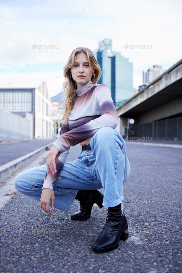 Beauty, fashion and portrait of a model in the urban road posing in trendy, stylish and edgy clothe