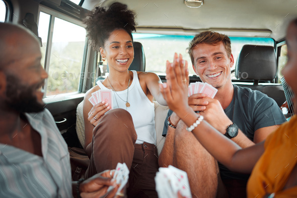 Card game, car and friends high five on a road trip enjoy holidays, vacation or fun weekend togethe